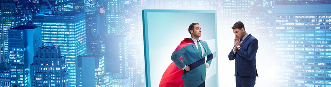 business man looking at its mirror, its image on the mirror is superman