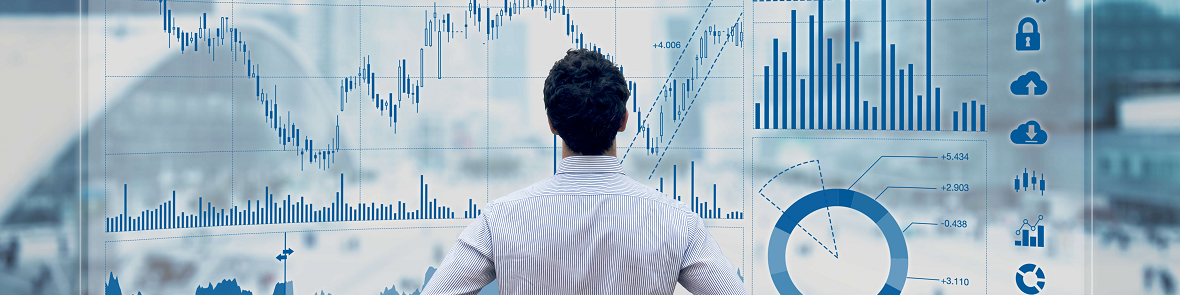 Man standing in front of financial data dashboard