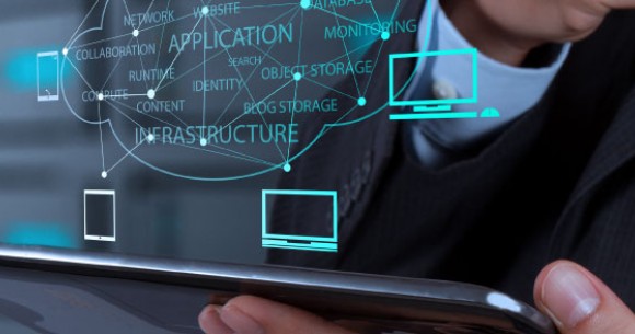 Futuristic image of person in suit looking at IT estate components and their connectivity